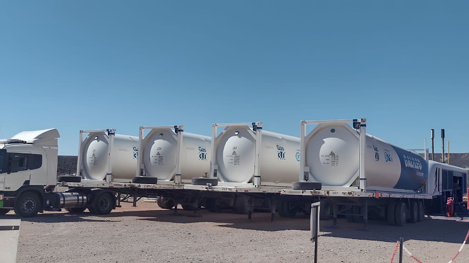 White cryogenic ISO LNG tank container on a highway trailer, ready for virtual-pipeline delivery.